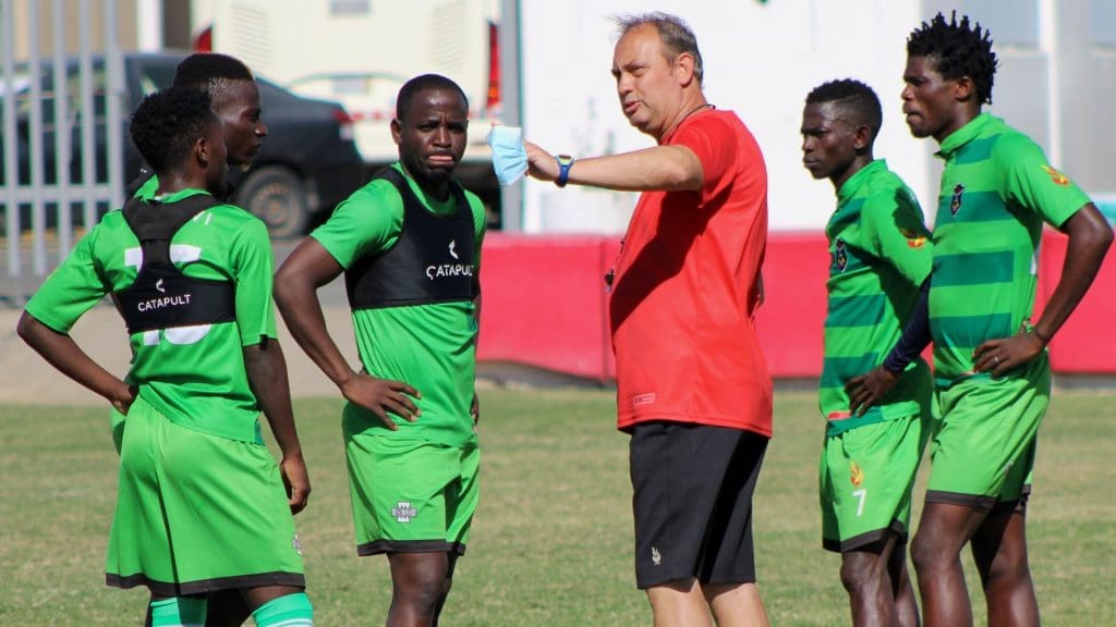 Malawi’s Flames coach Mario Marinica with Mhango and some of the national team players during a training camp