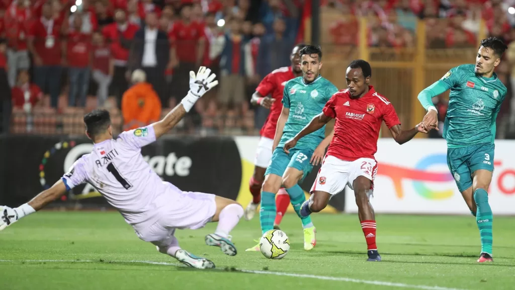 Percy Tau taking on Wydad defenders