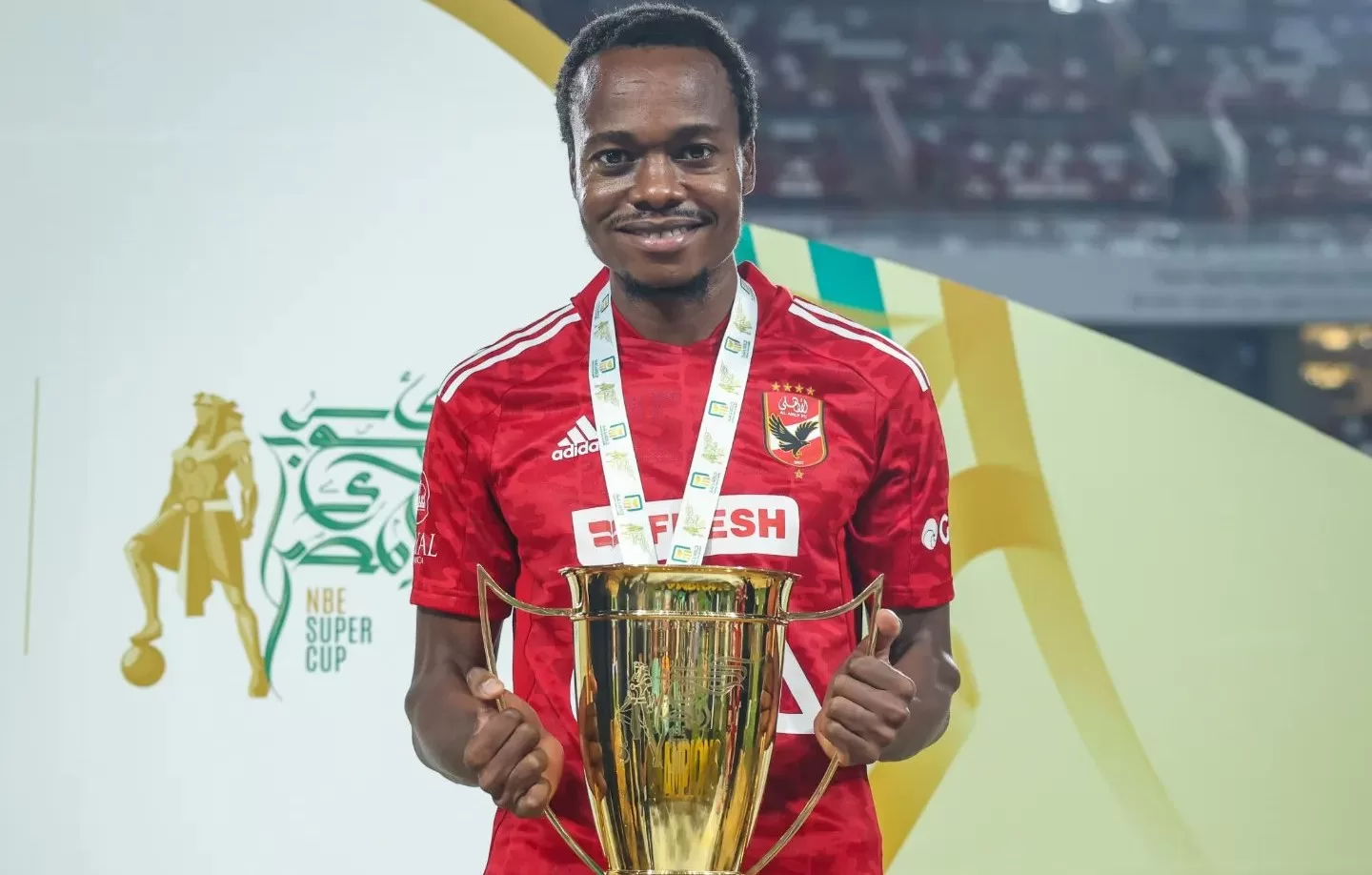 Percy Tau of Al Ahly celebrating after winning a trophy with the club