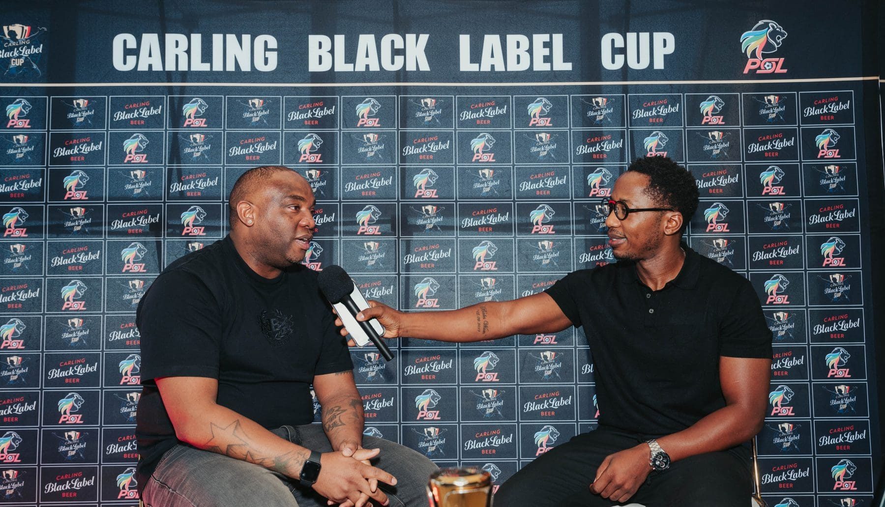 Benni McCarthy and Andile Ncube at an event