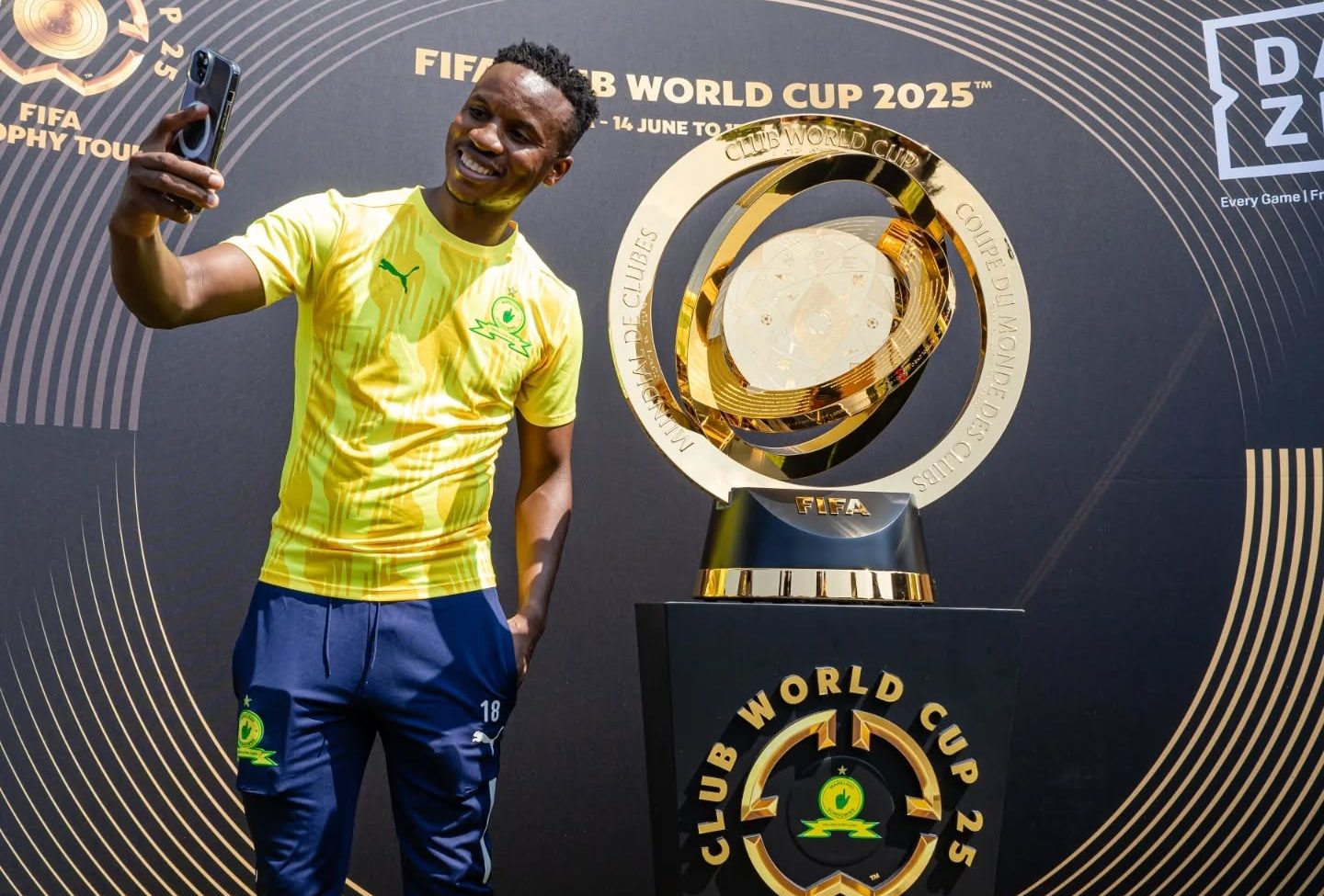 Mamelodi Sundowns star Themba Zwane taking a picture with the Club World Cup trophy