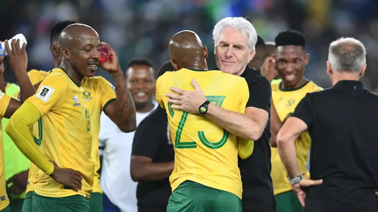 Hugo Broos of Bafana Bafana with his players