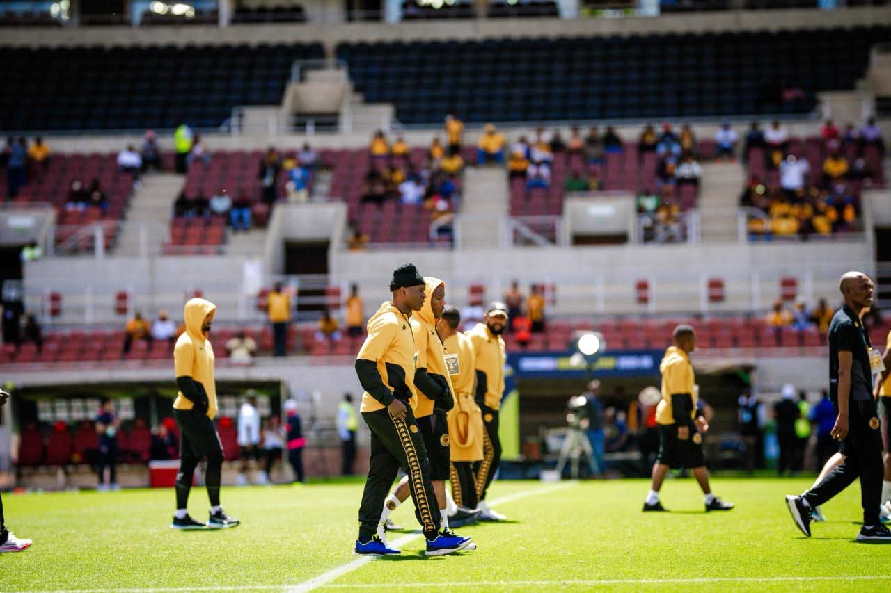 Kaizer Chiefs players doing a pitch inspection before a match at the New Peter Mokaba Stadium