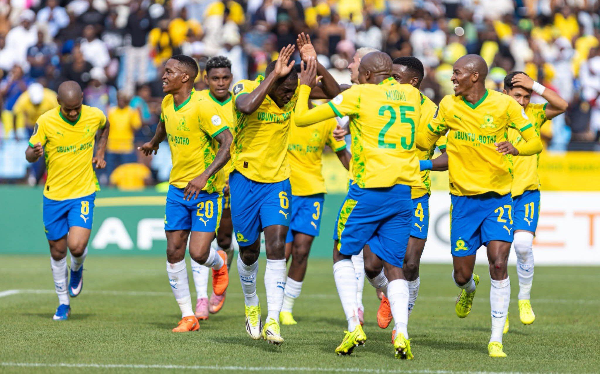 Mamelodi Sundowns players celebrate a goal during a CAF Champions League match.