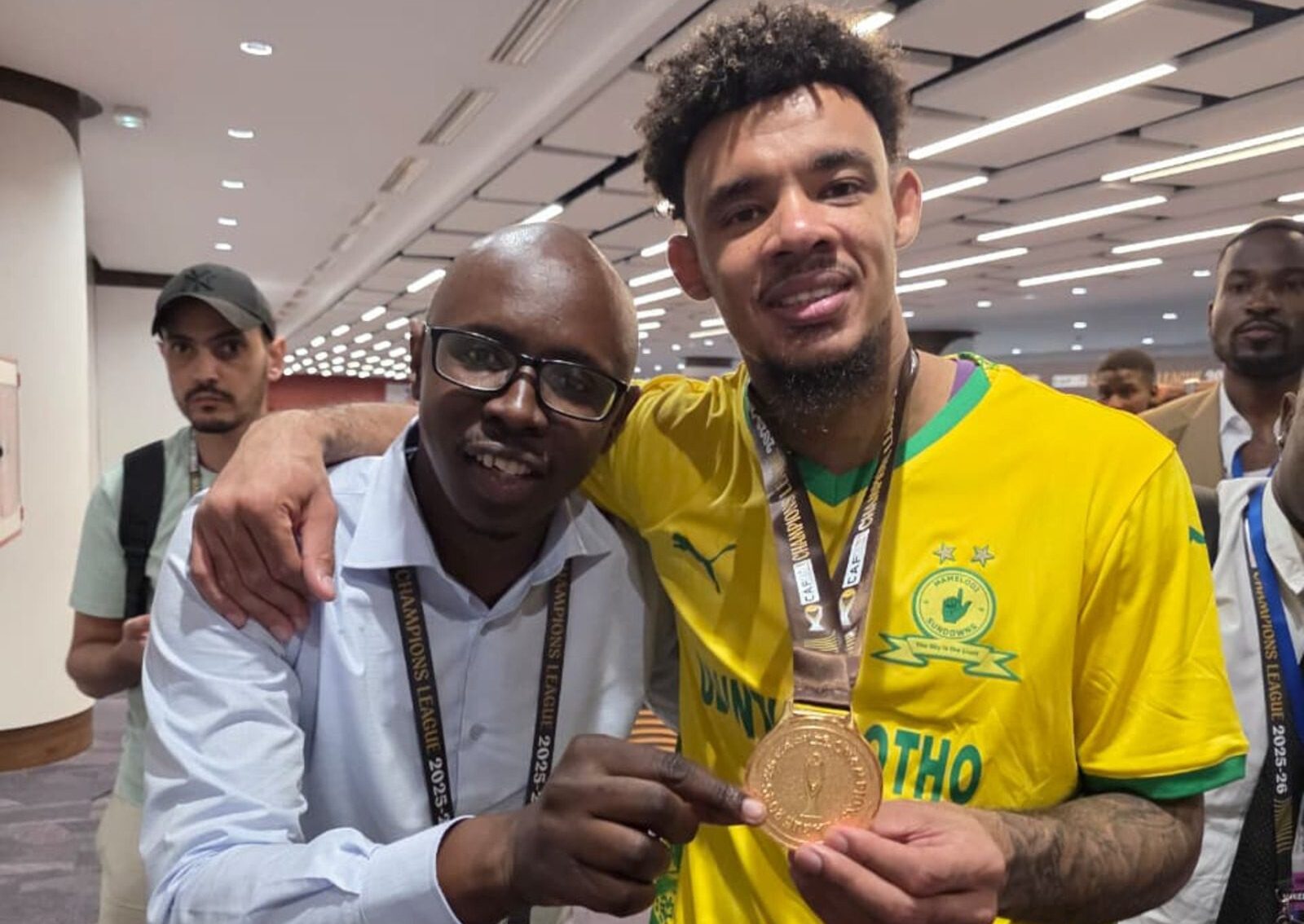 Mamelodi Sundowns goalkeeper Ronwen Williams shares a moment with media personality Mthokozisi Dube following Masandawana’s CAF Champions League final victory over local rivals in Rabat, Morocco.