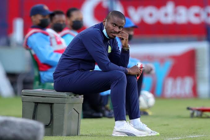 Rhulani Mokwena on the bench during a league game