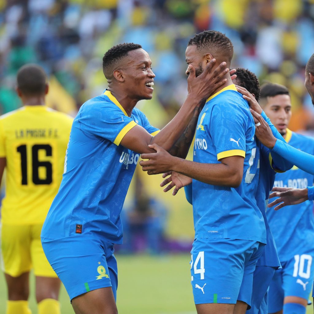 Grant Kekana celebrates with Sipho Mbule after scoring a goal