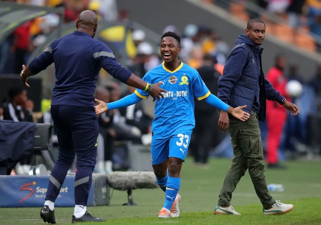 Mailula celebrating a goal with his coach Steve Komphela during the Carling Cup 