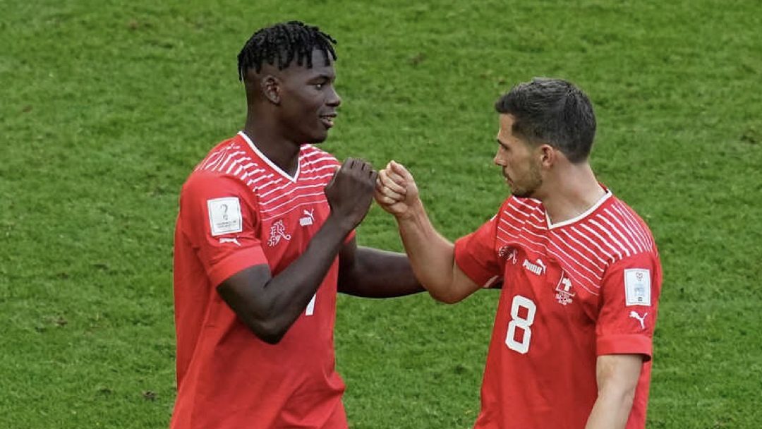 Switzerland and Monaco frontman Breel Embolo with his teammate against Cameroon.
