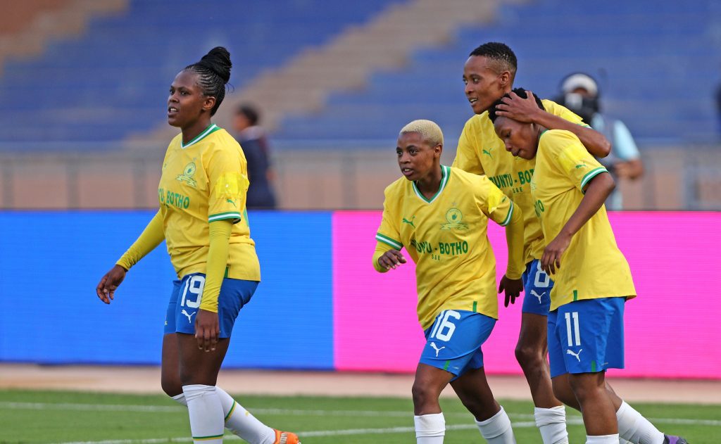 Chuene Morifi celebrating Lelona Daweti's goal with teammates 