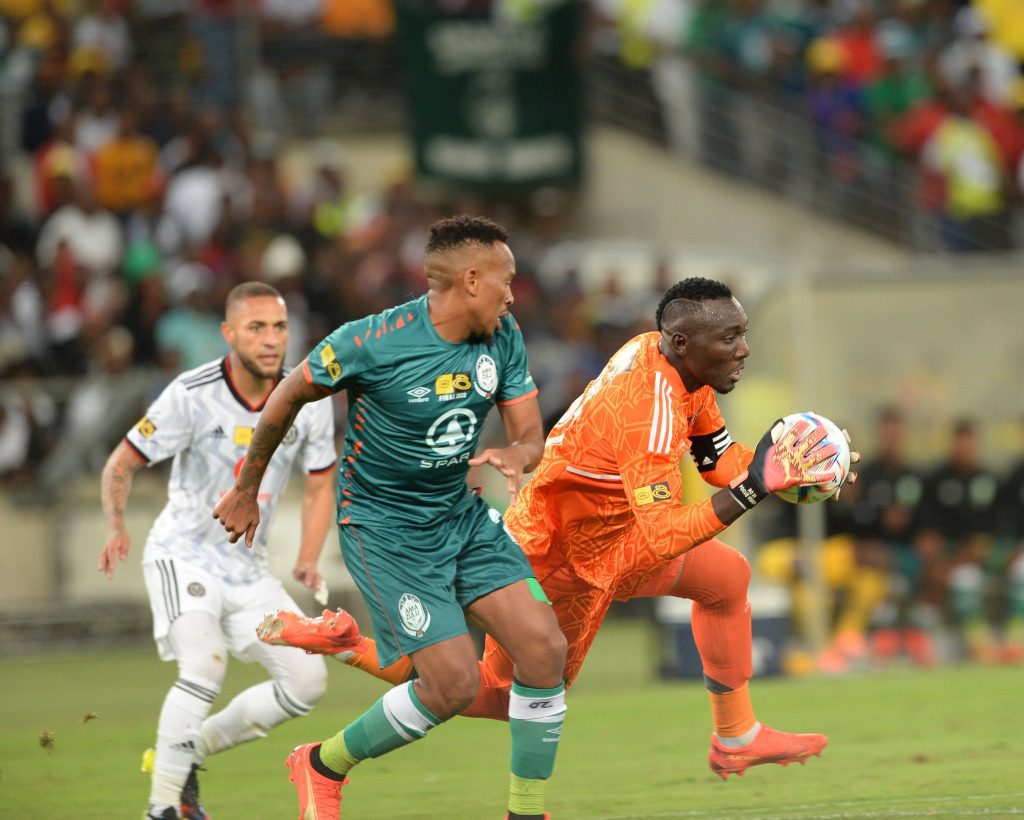 Bucs captain Ofori challenged by Majoro for the ball in the MTN8 final in Durban