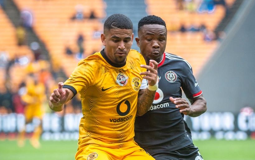 Keagan Dolly fighting for the ball against Paseka Mako in the Carling Cup semifinal at FNB Stadium