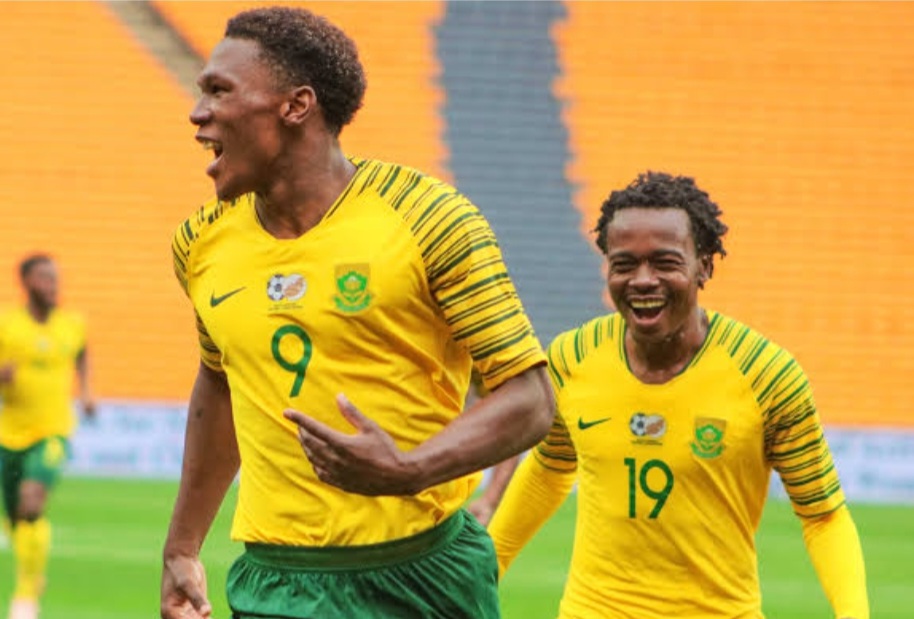 Lebo Mothiba celebrates with Percy Tau after scoring a goal for Bafana Bafana