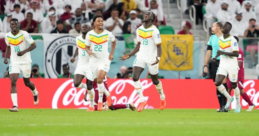 Senegal stars celebrating after beating Qatar 