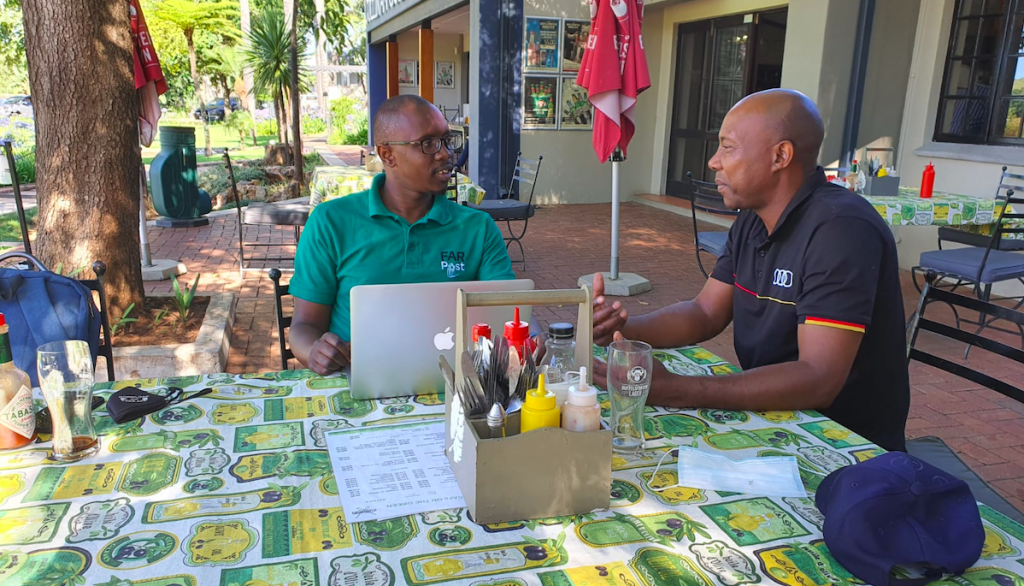 Bennett Mnguni chatting with FARPost journalist Mthokozisi Dube