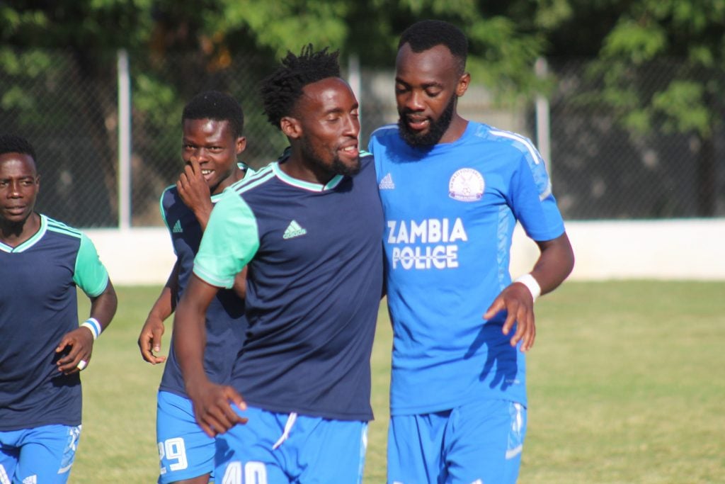 Justin Shonga celebrating a goal with a teammate