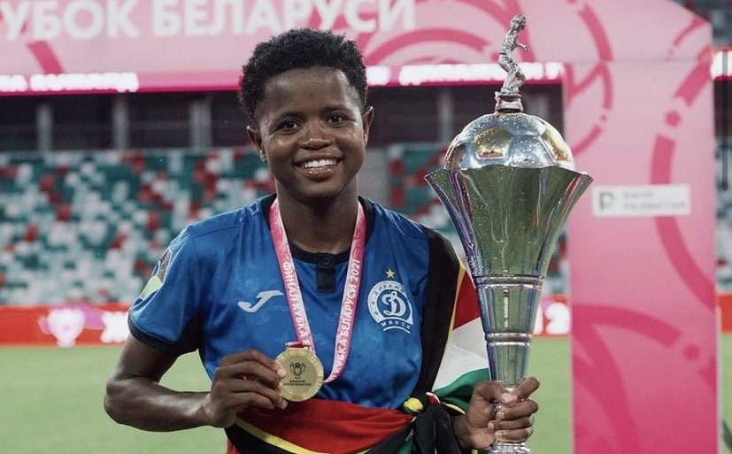 Banyana Banyana defender Lebohang Ramalepe holding one of the title she won with FC Dinamo