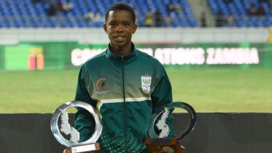 Amajimbos striker Siyabonga Mabena showing off Golden Boot and Best Player of the Tournament accolades