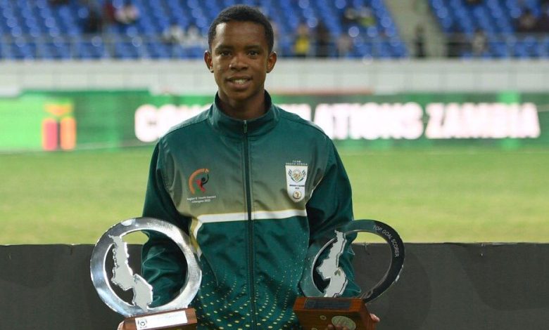 Amajimbos striker Siyabonga Mabena showing off Golden Boot and Best Player of the Tournament accolades