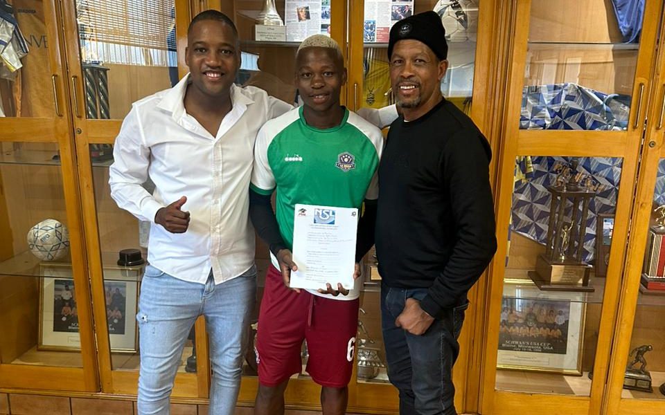 Chagi with his agent Andrew Matjila after signing for La Masia