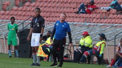 Coach Johnny Ferreira on the touchline in TTM's colours