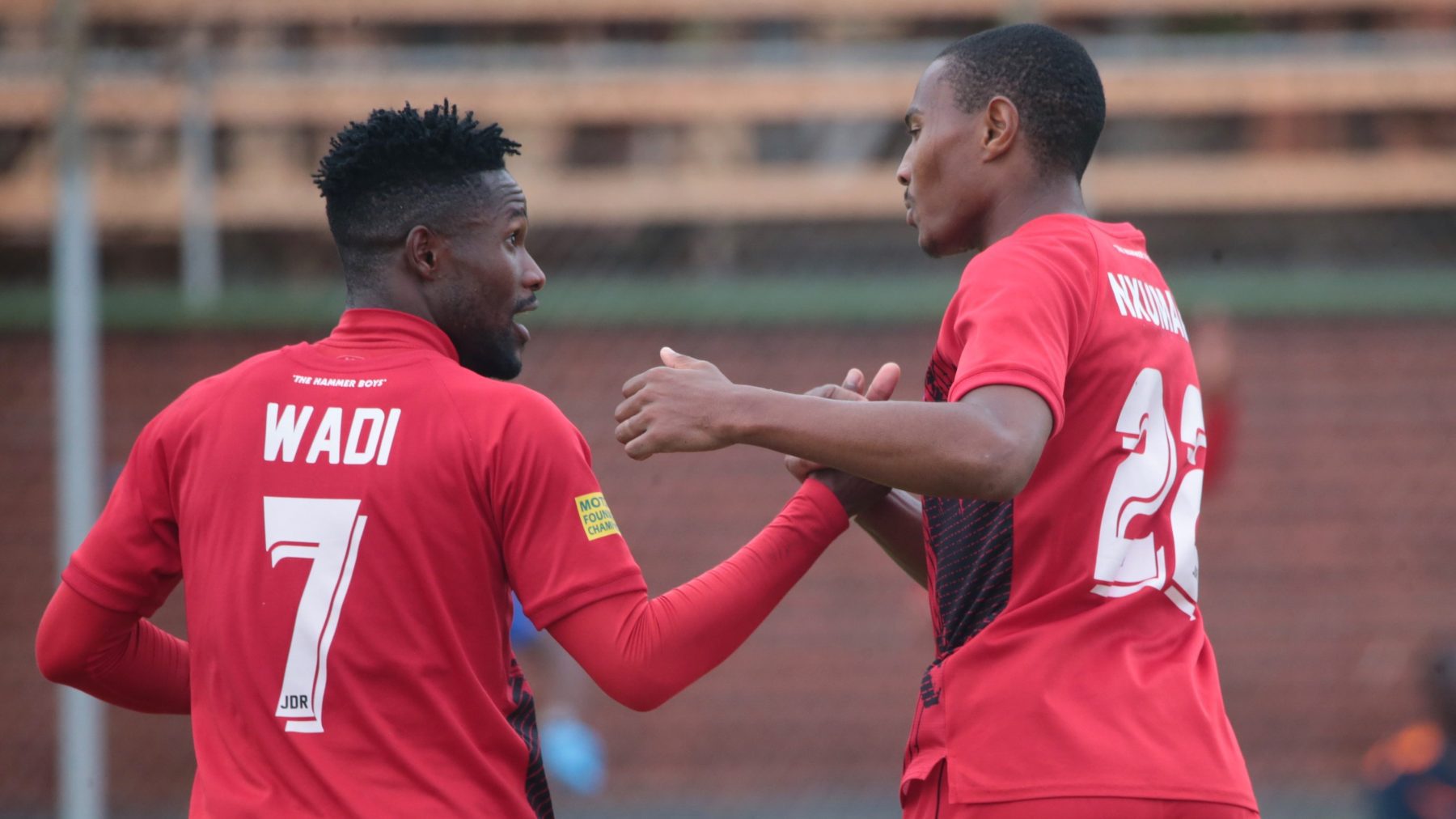 Prince Nxumalo celebrates with Ishmael Wadi