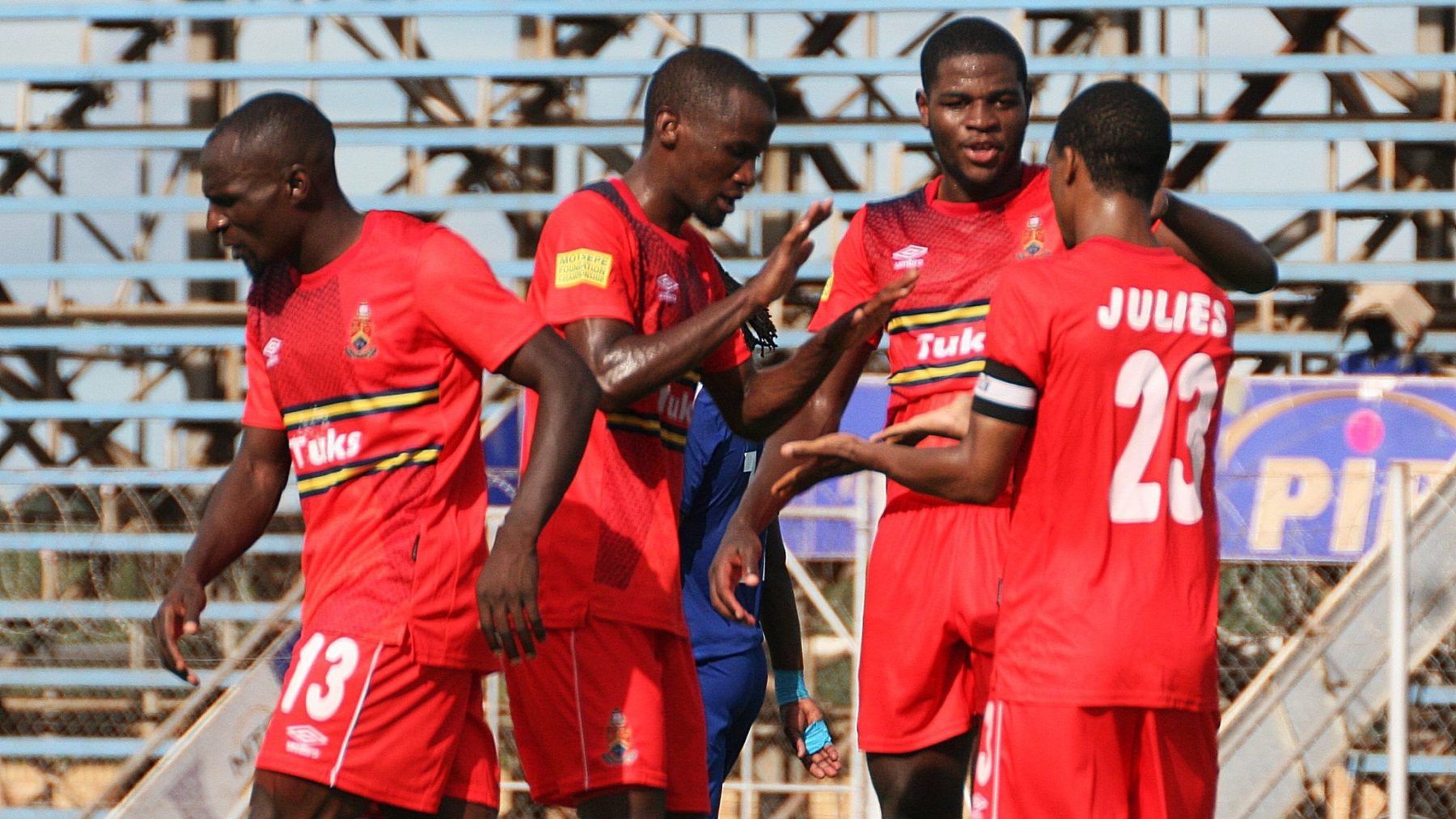 Ramagalela celebrating a goal with AmaTuks teammates