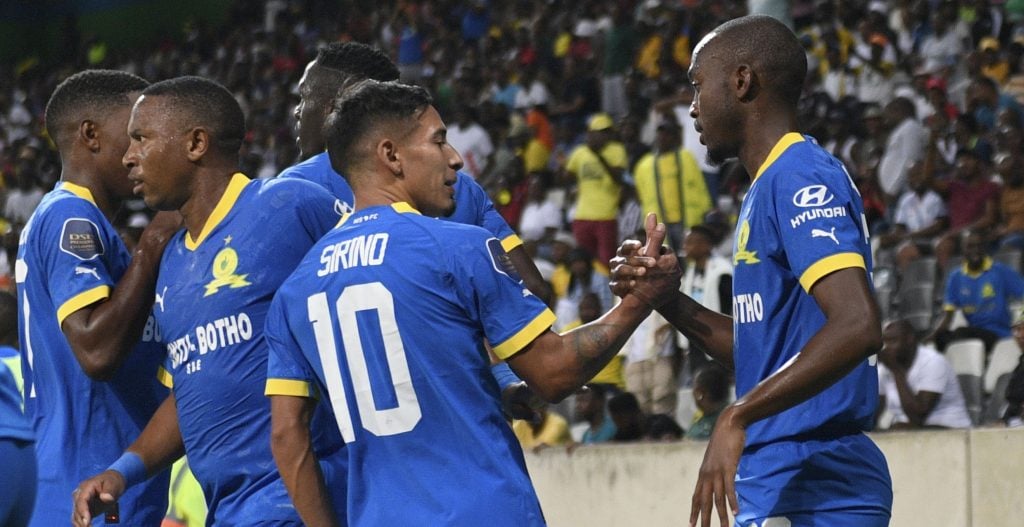 Grant Kekana and Themba Zwane's Mamelodi Sundowns teammates celebrating after scoring against TS Galaxy