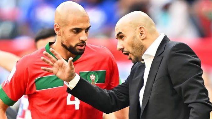Moroccan national team coach Walid Regragui giving instructions to his player. 