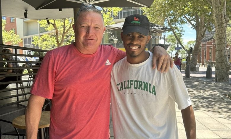 Gavin Hunt with Njabulo Blom outside a restaurant in JHB