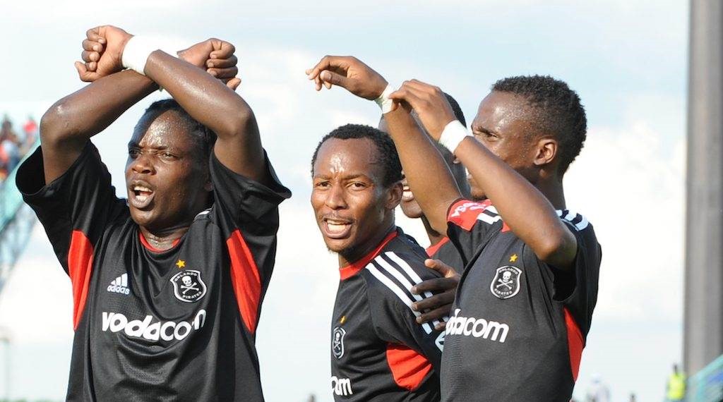 Joseph Kamwendo (left) and his then Orlando Pirates teammates such as Teko Modise (right)