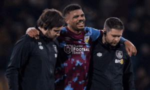 Medical staff assisting Lyle Foster of Burnley off the pitch