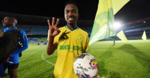Cassius Mailula poses with a match ball after scoring a hat trick