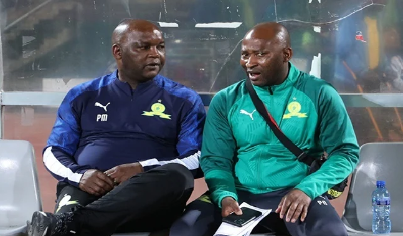 Peter Ndlovu with Pitso Mosimane having a discussion 