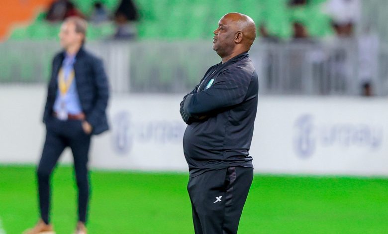 Pitso Mosimane watching his troops during a game