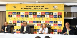 SAFA member sitting alongside Banyana Banyana's head coach, Desiree Ellis