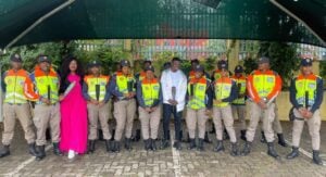 Mamelodi Sundowns, midfielder, Teboho Mokoena standing alongside Metro Police officers