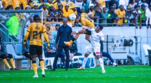 Arthur Zwane following the action