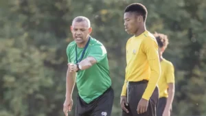 Coach Duncan Crowie and his player.