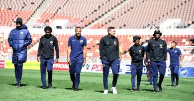 Kaizer Chiefs players, including Njabulo Ngcobo doing pitch inspection