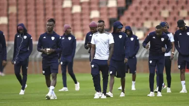 Sekhukhune United players doing pitch inspection