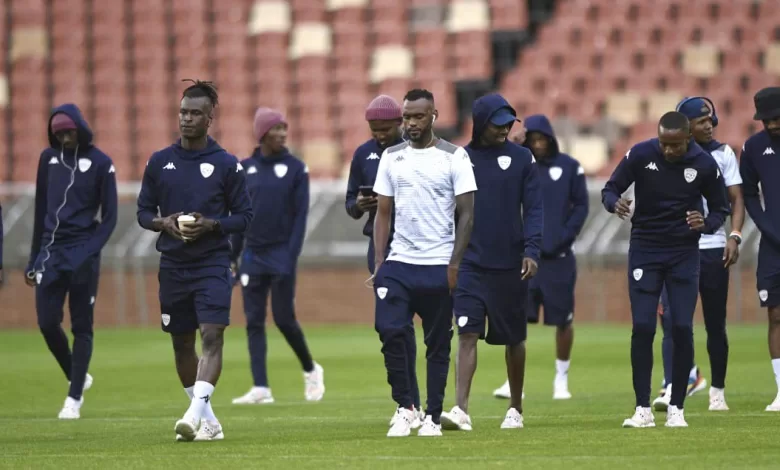 Sekhukhune United players doing pitch inspection