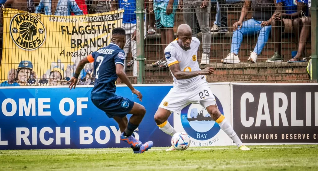 Katlego Maphathe challenging Sifiso Hlanti on the ball.