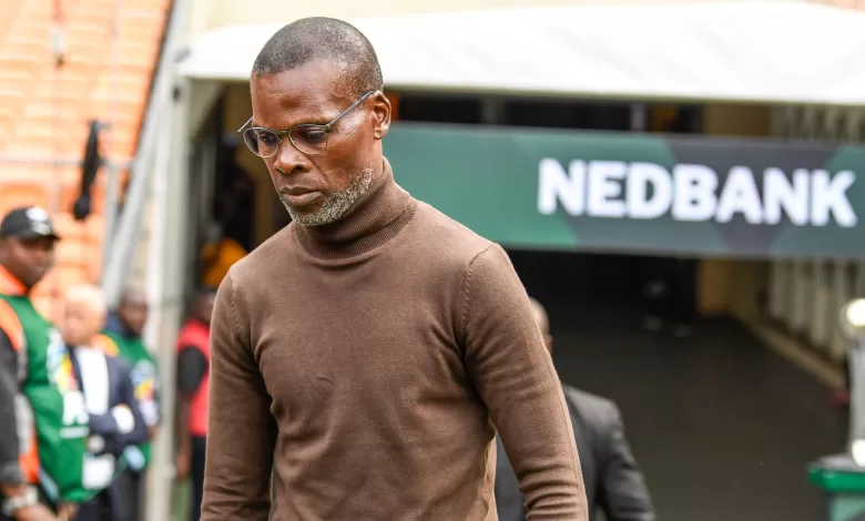 Arthur Zwane walking to the bench before a game.