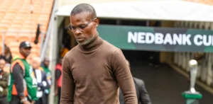 Arthur Zwane walking to the bench before a game.