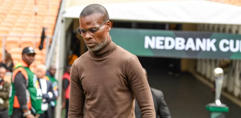 Arthur Zwane walking to the bench before a game.