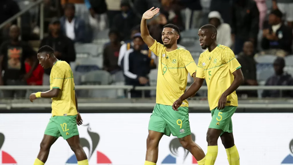 Lyle Foster waving at fans during Bafana Bafana game.