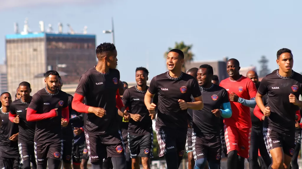 Chippa United players jogging.