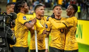 Dillan Solomons celebrating a goal with his Kaizer Chiefs teammates.