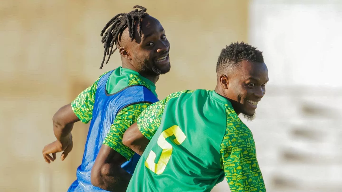 Fiston Mayele alongside a Young Africans teammate at training